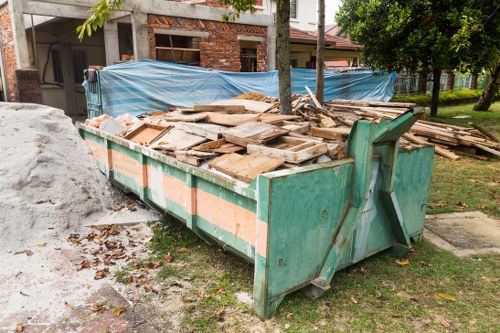 Professional team clearing a cluttered garage in South East London