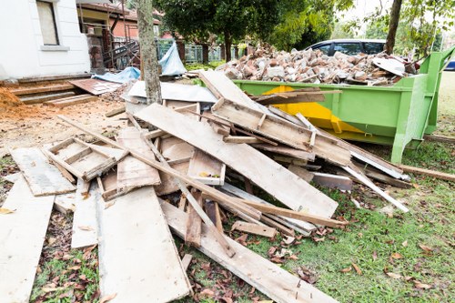 Home clearance team organizing items in a South East London home